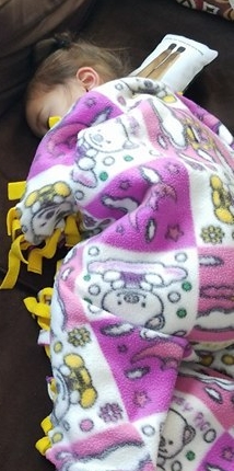 tay sleeping with her mommy doll